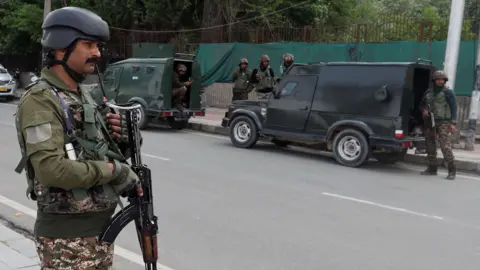 Indian security personnel stand guard in Srinagar, in Indian-administered Kashmir on 10 May