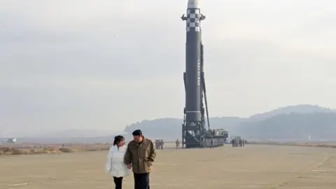 KCNA Kim Jong with his daughter