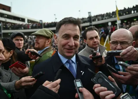 Getty Images Henry de Bromhead speaking to the media at the Cheltenham Festival in March 2022
