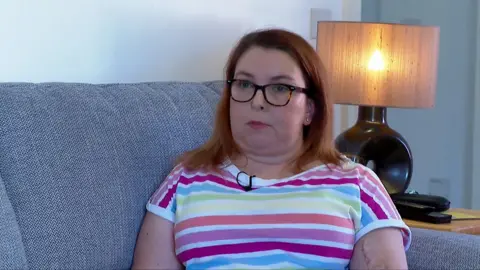 Head and shoulders shot of Helen sitting on a couch