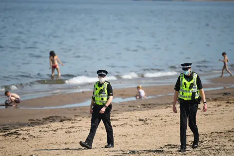 Getty Images Police on beach