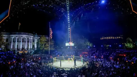 Reuters Justin Gaethje, mixed martial artist, and Ilia Topuria, mixed martial artist, during a lightweight championship bout during the UFC Freedom250 fight on the South Lawn of the White House in Washington, DC