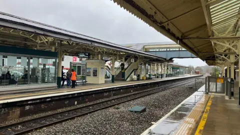 Chippenham train station pictured on a wet, overcast day