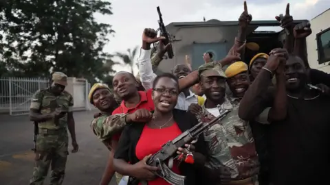 AFP Woman with soldiers