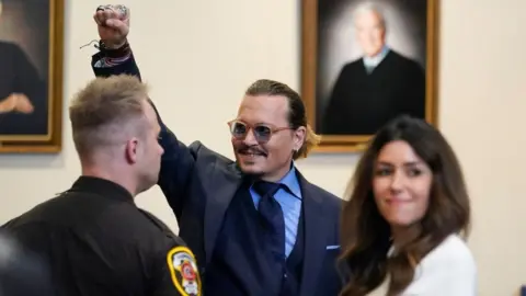 Getty Images Johnny Depp stands with his lawyer in court