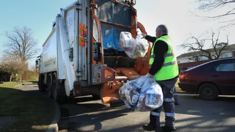 Getty Images Bin contractor collects recycled waste material