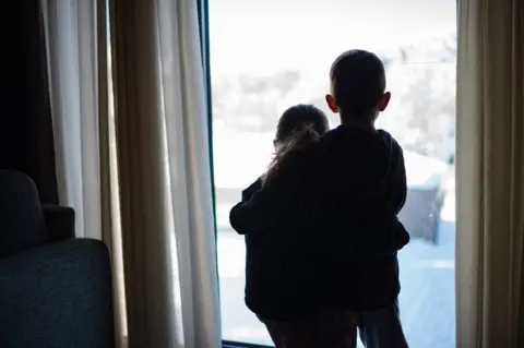 Getty Images children comforting each other