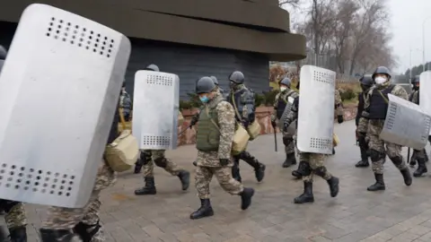 AFP via Getty Riot police in Almaty