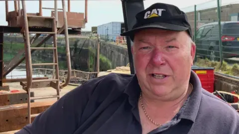 Man sitting in fork lift 