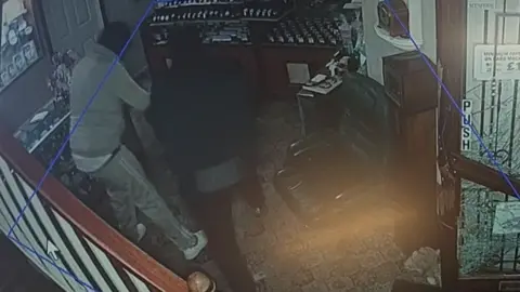 Bedfordshire Police CCTV footage of one of the raids. The men's faces cannot be seen. 