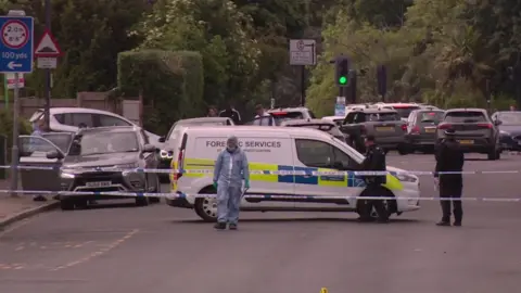BBC A forensic van at on Kingsbury Road