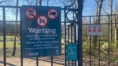 Photograph of railings at the entrance to Stoneleigh park in Derker, where there have been problems with anti-social behaviour