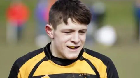 Other Aaron in a yellow rugby kit 