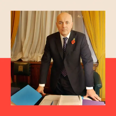 AFP via Getty Images Then-Tory party leader Iain Duncan Smith at work in his office in the Houses of Parliament
