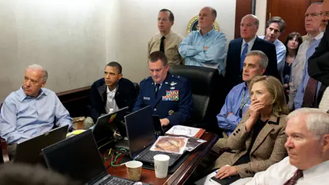 Joe Biden, Barack Obama and Hilary Clinton in the Situation room watching a screen out of shot