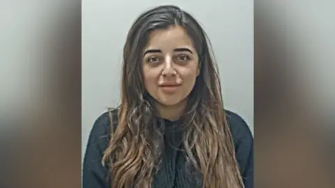 Lancashire Constabulary Samarah Kamal has long brown hair and is wearing a dark top