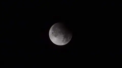 John Bogie The moon against a black night sky over Scotland