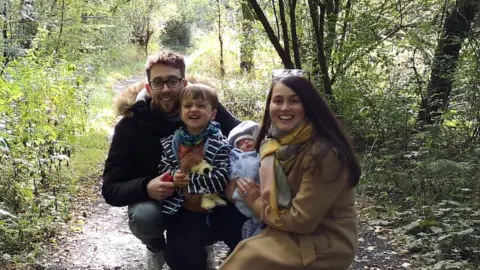 Sara Still Sara, Andrew and their two children Ezra and Eliza in woodland path