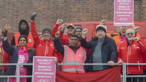 Getty Images Royal Mail workers on a strike picket line in September 2022