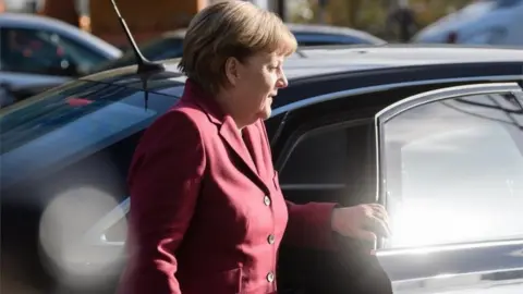 EPA Merkel arrives for talks on Friday