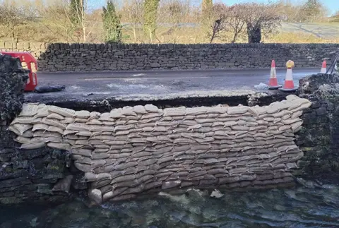 Derbyshire County Council Sandbags at wall collapse site