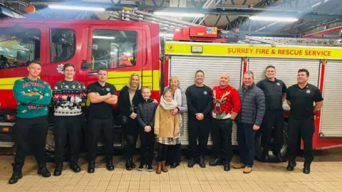 BBC The Surrey Fire and Rescue Service welcome siblings George and Olivia who saved their family from a fire