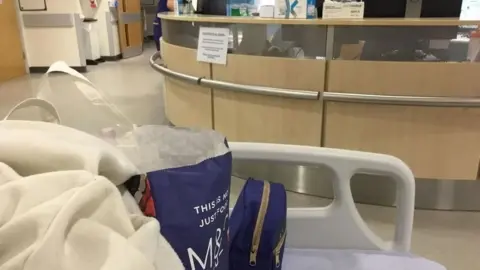 Bed situated on a hospital ward corridor