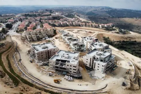 EPA A picture taken with a drone shows a construction site of a new neighborhood in the Neve Daniel settlement, in the Gush Etzion settlement block at the West Bank, 15 February 2023.