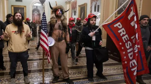 EPA US Elections protest: Jacob Chansley (C) with other Pro-Trump supporters, as they demonstrate ouside Senate Chamber at the U.S. Capitol after breaching security, January 6th 2021