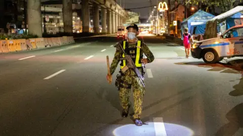 Getty Images A police officer patrols in the Philippines