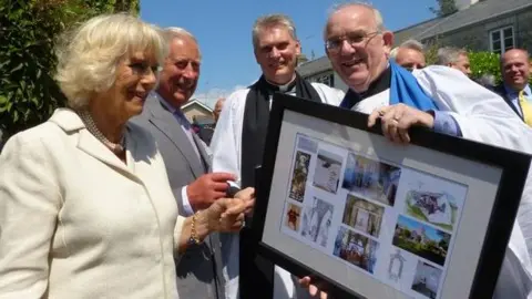 Church in Wales The Prince of Wales and the Duchess of Cornwall (now the King and Queen) study the architects' plans during a visit to the newly opened Galilee Chapel in 2015.