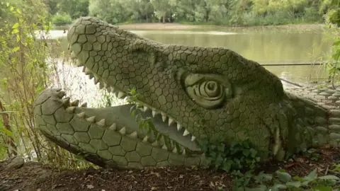 A dinosaur sculpture successful  Crystal Palace Park