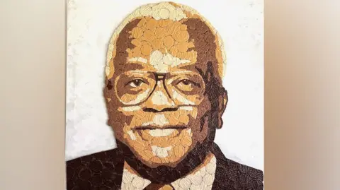 Ed Chapman Trevor McDonald's portrait made of biscuits in a mosaic