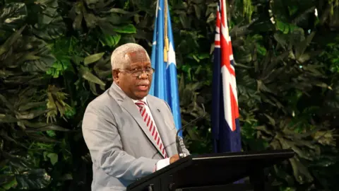 Getty Images Solomon Islands leader Rick Houenipwela speaks in New Zealand in June