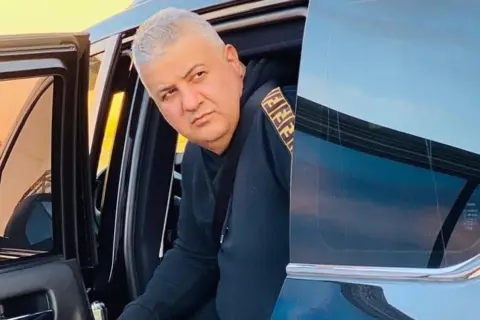 Instagram Naji Sharifi Zindashti getting out of a car