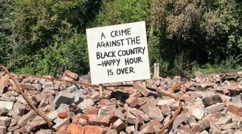 Crooked House bricks with sign