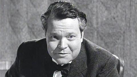 A black and white image of Orson Welles.