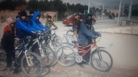 Sahba Barakzai Sahba Barakzai, and a group of children out cycling
