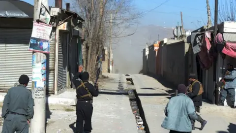 AFP Dust blows down a street after one of the explosions