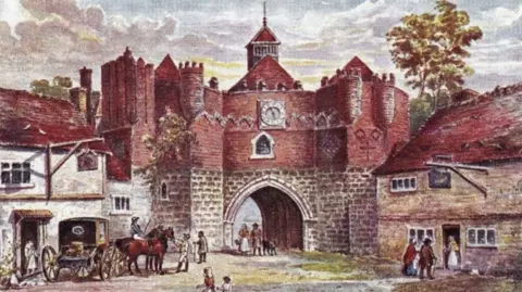 Phil Roberts An artist's impression of the West Gate of Ipswich in about the late 18th Century. It is a colourful picture with the gate in the middle, stone built to above its arch and brick built and castellated above that. On the left and right are two two storey buildings. There is a coach on the left with a rider on one of its pair of horses. People are standing in doorways and walking through the gate. 