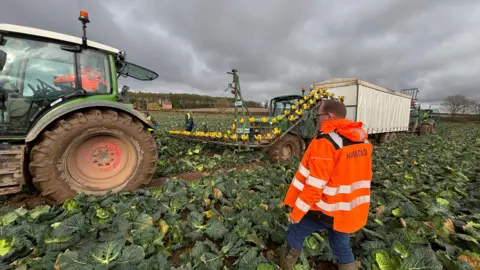 Farmers working in a field in Nottinghamshire