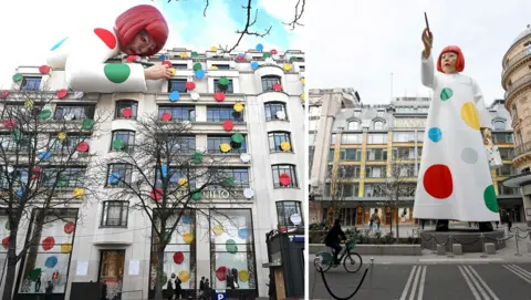 AFP / Chesnot via Getty Images A composite image shows on the left the sculpture bent over the store painting dots that cover the facade of the building, and on the right a depiction of the huge sculpture in the likeness of Yayoi Kusama standing up between the headquarters of the Maison Louis Vuitton and the Samaritaine department store on March 06, 2023 in Paris, France.