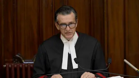 Judge sitting at stand in court