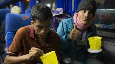 AFP Venezuelan nationals travel by bus in southern Ecuador towards the border with Peru on August 24, 2018