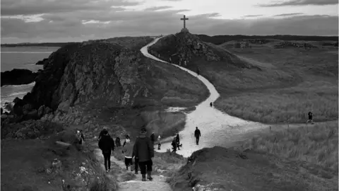 Mohamed Hassan A path leading to a cross in Llanddwyn, Anglesey