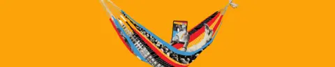 Thin dark yellow banner promoting the Essential List newsletter with a colourful hammock in the centre, with the arms and legs of someone inside visible. They are holding a tablet to read.