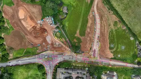Aerial view of area where roadworks are taking place on the A358. You can see single carriageway near fields.