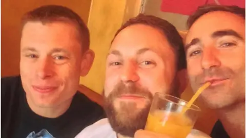 Andy Watts James Kirby with two friends enjoying a drink