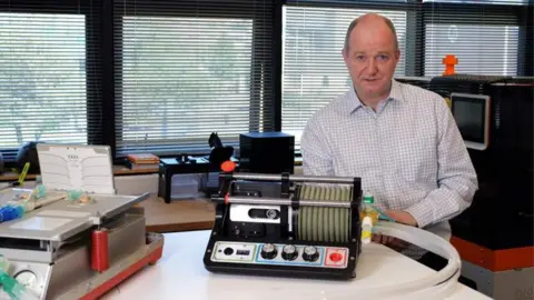 Swansea University Co-inventor Dr John Dingley with the ventilator attached to a mechanical lung