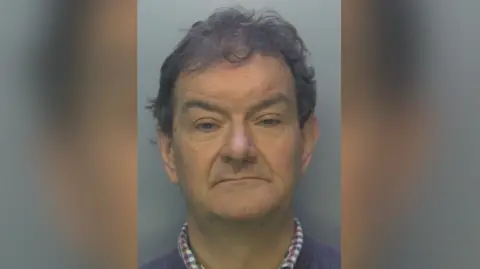 Surrey Police Police mugshot of James Cartwright